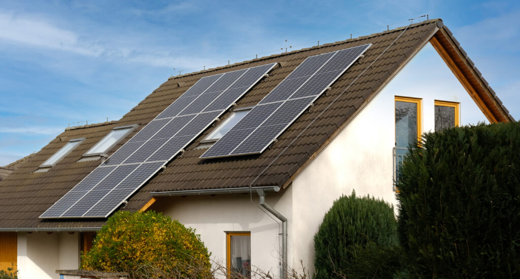 Home with solar panels on the roof and energy-efficient windows